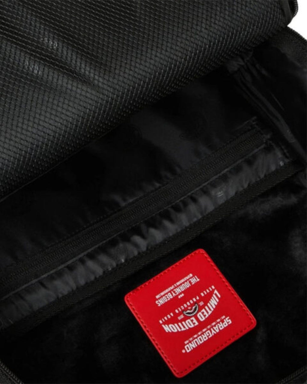 BLACKED OUT EMBOSSED GOLD TOOTH BACKPACK 