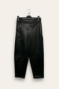Carrot-shaped faux leather trousers