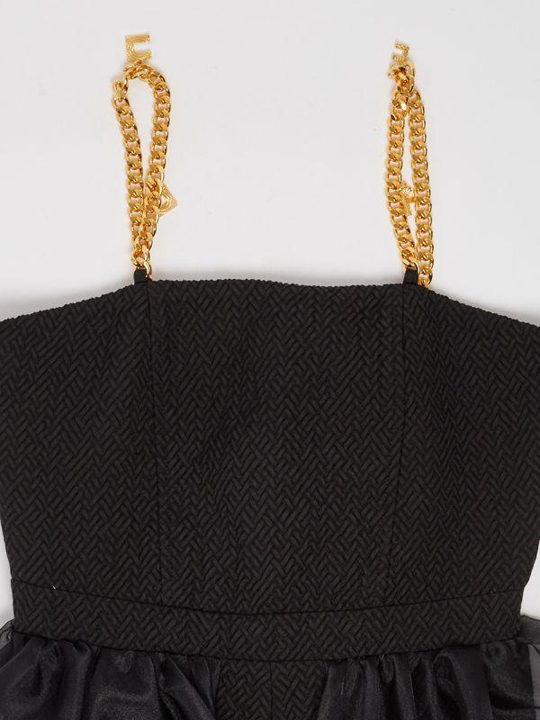 TUTA CON BRETELLE CON CHARMS 
