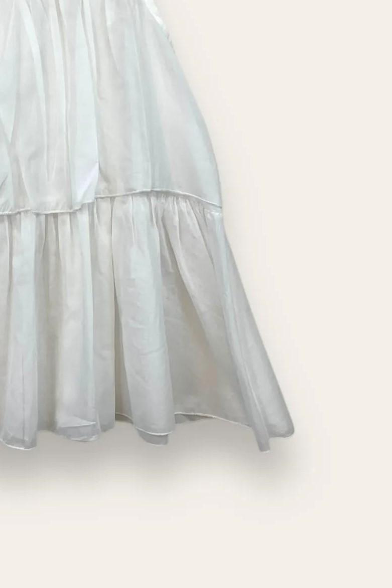 Canotta a balze con bottone dietro 