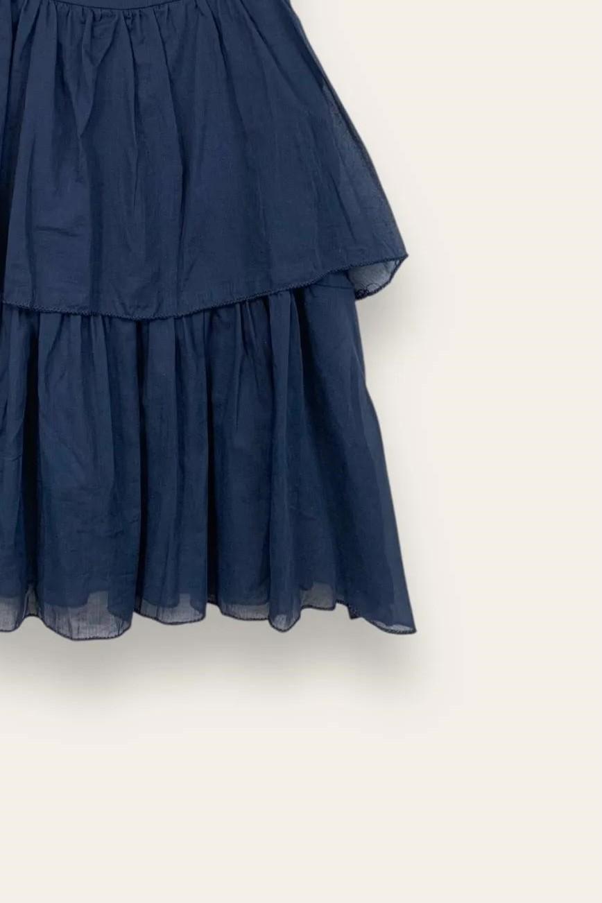 Canotta a balze con bottone dietro 