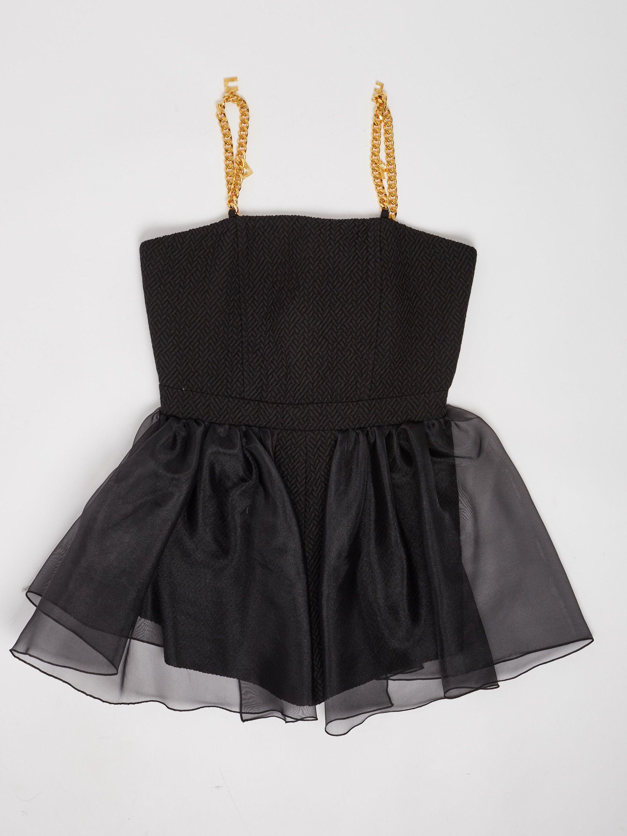 TUTA CON BRETELLE CON CHARMS 